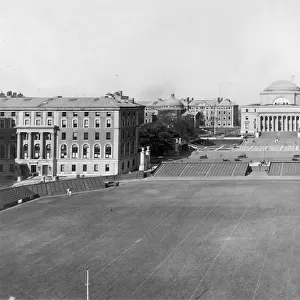 circa 1915: View of the campus of Columbia University, with the football field in the foreground