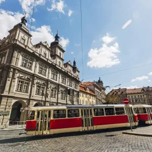 Classic red tram on the streets of Lesser town (Mala Strana) in Prague, Czech Republic Classic red tram on the streets of Lesser town (Mala Strana) in Prague, Czech Republic