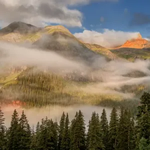 clearing undercast fog at sunrise, alpenglow clearing undercast fog at sunrise, alpenglow