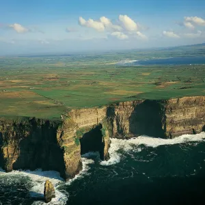 Cliffs Of Moher and Liscannor Bay in background, County Clare, Ireland Cliffs Of Moher and Liscannor Bay in background, County Clare, Ireland