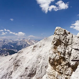 Climber climbing along the Via Ferrata Ivano Dibona climbing route on Monte Cristallo to the summit of Cristallino, Dolomites, Belluno, Italy, Europe