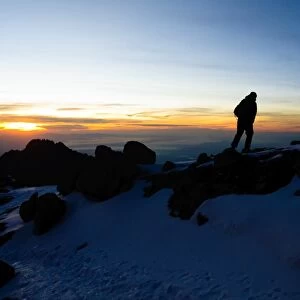 Climber Summiting Mt. Kilimanjaro