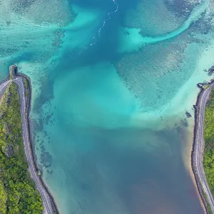 Coastal road along turquoise lagoon, aerial view, Baie Du Cap, Mauritius Coastal road along turquoise lagoon, aerial view, Baie Du Cap, Mauritius