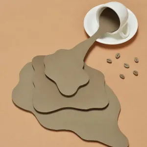 Coffee Spilling out from a coffee cup Coffee Spilling out from a coffee cup