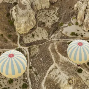Colorful Hot Air Balloons Print over Red Valley at Cappadocia Colorful Hot Air Balloons Print over Red Valley at Cappadocia