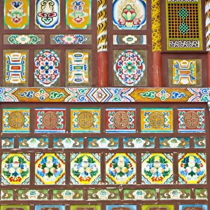 Colorful Tibetan designs on walls of temple, Jiuzhaigou National Scenic Area, Sichuan Province, China