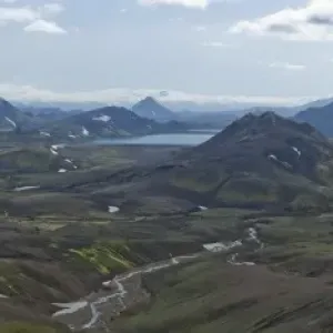 Colorful volcanic landscape with snow fields in front of the Eyjafjallajoekull glacier, Alftavatn lake, Iceland, Europe Colorful volcanic landscape with snow fields in front of the Eyjafjallajoekull glacier, Alftavatn lake, Iceland, Europe