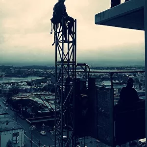 Construction Worker At Rest High Up In The Air