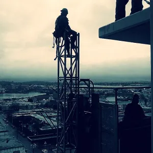 Construction Worker At Rest High Up In The Air Construction Worker At Rest High Up In The Air