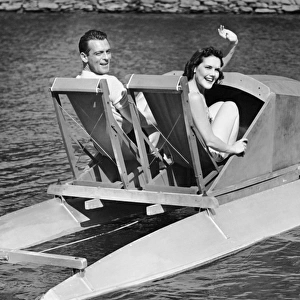 Couple on lake in paddle boat