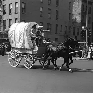 Covered Wagon on street during parade