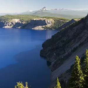 Crater Lake And Distant Volcanic Mountains