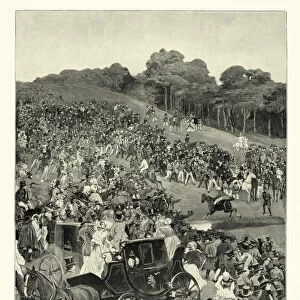 Crowd of people watching a steeplechase, horse race