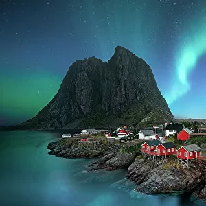 dawn in small viilage, Lofoten and magic northern lights in sky