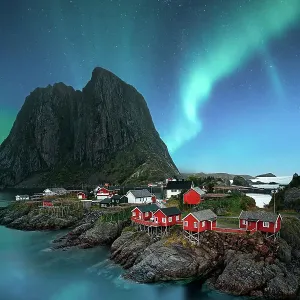dawn in small viilage, Lofoten and magic northern lights in sky dawn in small viilage, Lofoten and magic northern lights in sky