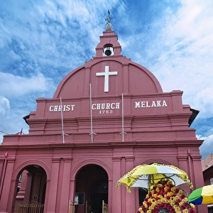 Decorated trishaw in front of Christ Church Melaka