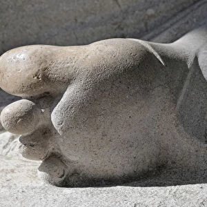 Detailed view of the foot of a sculpture