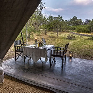 Dining outside of luxury tent, Machaba Camp, Okavango Delta, Botswana