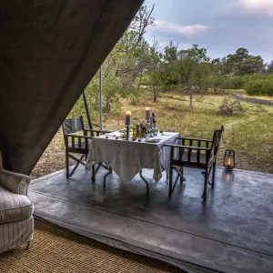 Dining outside of luxury tent, Machaba Camp, Okavango Delta, Botswana