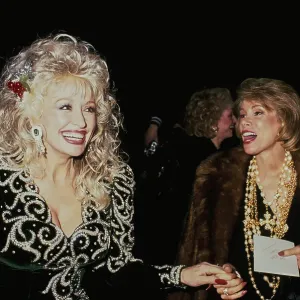 Dolly Parton And Joan Rivers Attend Sandy Gallin's Christmas Party