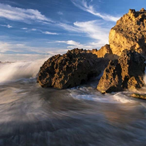 Dramatic seascape of Waves Crashing over Rocks on the beach at Kenton-On-Sea, Eastern Cape Province, South Africa