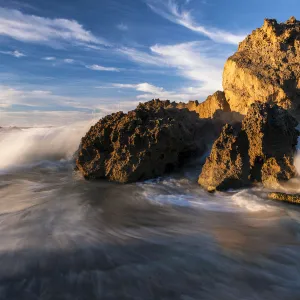 Dramatic seascape of Waves Crashing over Rocks on the beach at Kenton-On-Sea, Eastern Cape Province, South Africa