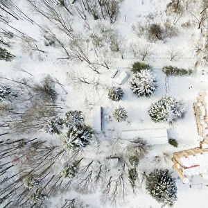 Drone picture taken from directly above of the winter landscape of the Montseny nature reserve covered with snow