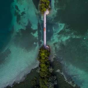 Drone shot looking down on a bridge crossing over lake Konstanz, Bavaria, Germany