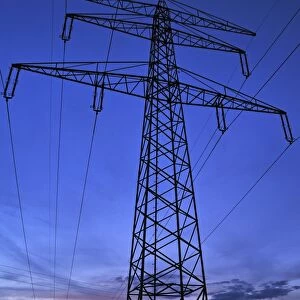 Electricity pylon against a blue evening sky, Eckental, Middle Franconia, Bavaria, Germany