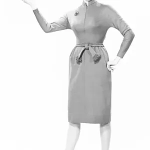 Elegant woman standing in studio, gesturing, (B&W), portrait Elegant woman standing in studio, gesturing, (B&W), portrait