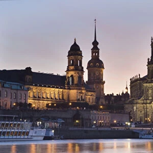 Evening mood in Dresden, as seen from the bank of the Elbe River with a view towards the Terrassenufer promenade with the Castle and Castle Church, Dresden, Saxony, Germany, Europe