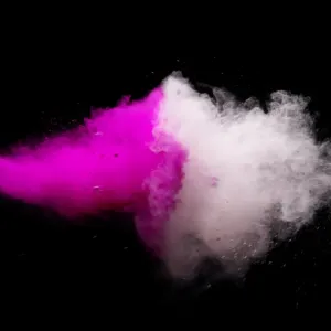 Colored Powder Explosion Print on Black Stone Backdrop Colored Powder Explosion Print on Black Stone Backdrop