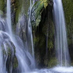 Extreme silky water jets in a waterfall with moss Extreme silky water jets in a waterfall with moss