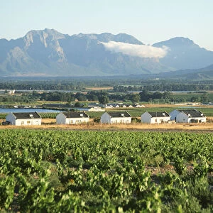 Farm Workers Cottages with Mountains in the Background