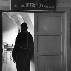 US Airforce Pilot Standing in Doorway with Sign US Airforce Pilot Standing in Doorway with Sign