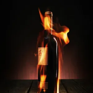 Darkened Wine Bottle Print with Flickering Flames Darkened Wine Bottle Print with Flickering Flames