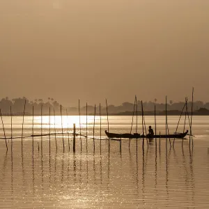 Fishermen in boats in the evening light, Taungthaman Lake, Mandalay, Myanmar