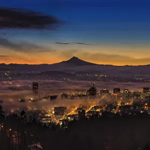 Fog rolling in at dawn over the city of Portland