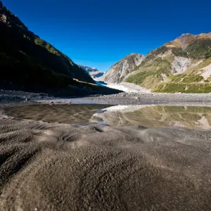 Fox glacier with sand and reflection Fox glacier with sand and reflection