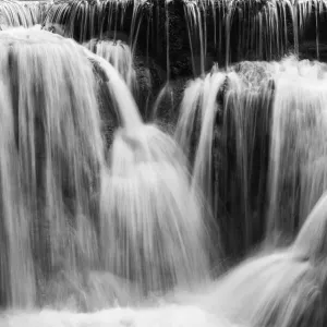 Full frame close-up of a cascade at the Tat Kuang Si Waterfalls near Luang Prabang in Laos. Natural abstract art in black and white Full frame close-up of a cascade at the Tat Kuang Si Waterfalls near Luang Prabang in Laos. Natural abstract art in black and white