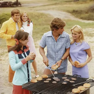 Friends having barbecue, smiling