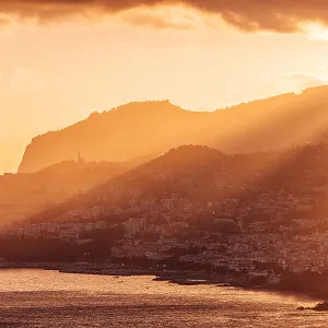 Funchal city skyline and Madeira island landscape at sunset, Portugal