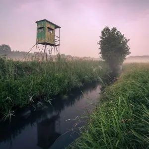 German floodplain landscape in Brandenburg with high seat on the Nuthe, Luckenwalde, Germany German floodplain landscape in Brandenburg with high seat on the Nuthe, Luckenwalde, Germany