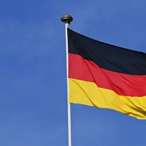 German national flag against blue sky