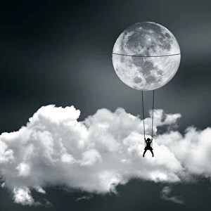 Girl swinging on the moon