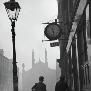 Gorbals area of Glasgow; Two young boys walking along a street in 1948