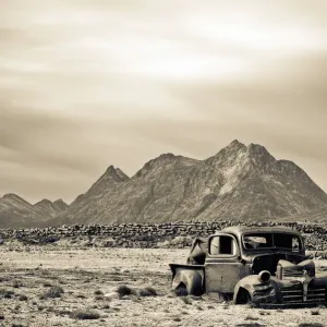Abandoned US Airforce truck and fuel barrels in Tasiilaq, Greenland Print