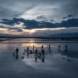 Group of people making salt Group of people making salt