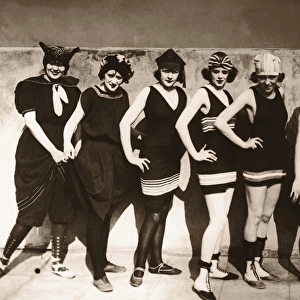 Group of young women wearing bathing suits, portrait (B&W sepia)