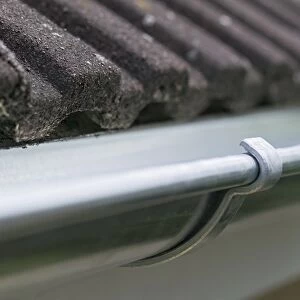 Guttering on the side of a house roof